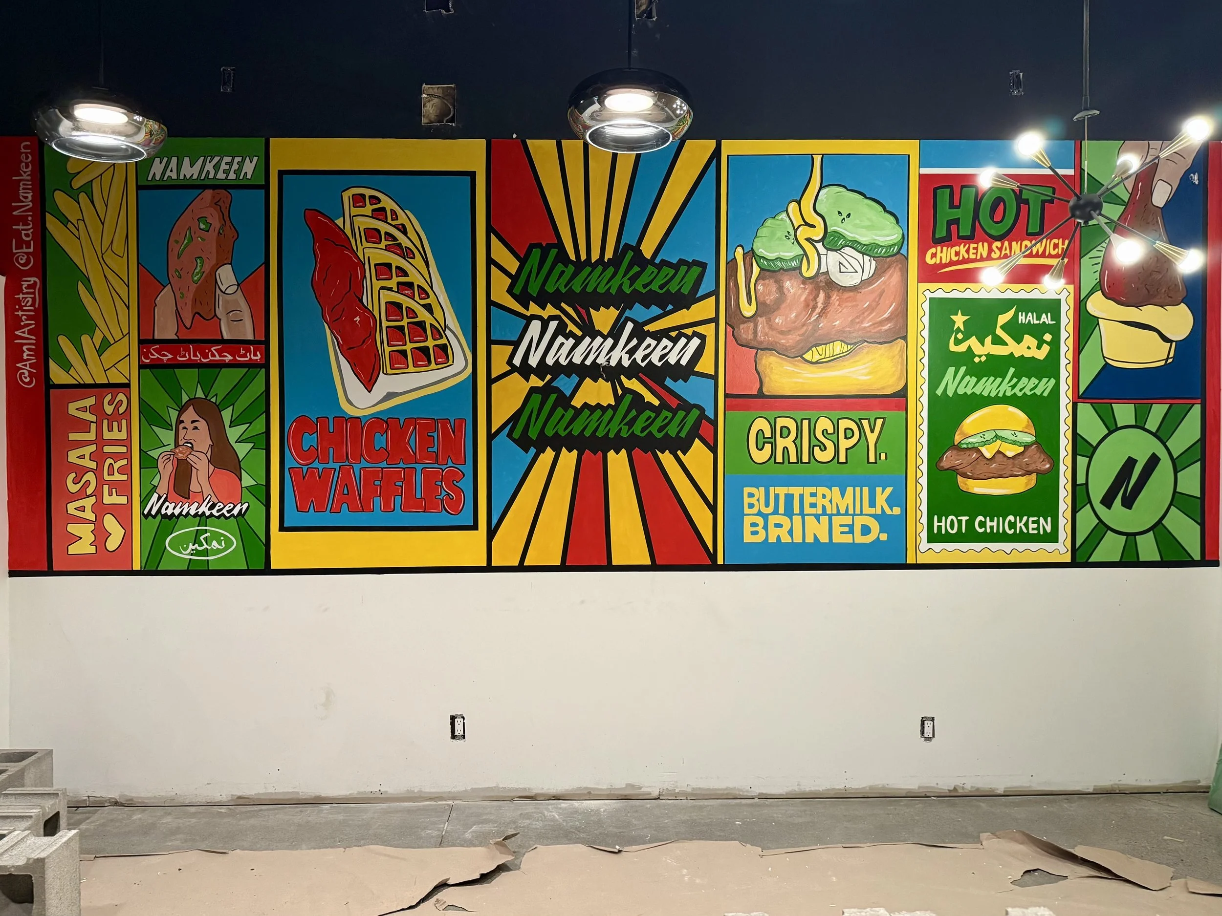 Colorful mural advertising fried chicken dishes, including chicken waffles, hot chicken, and fried chicken sandwiches, with illustrations of food and graffiti-style text.