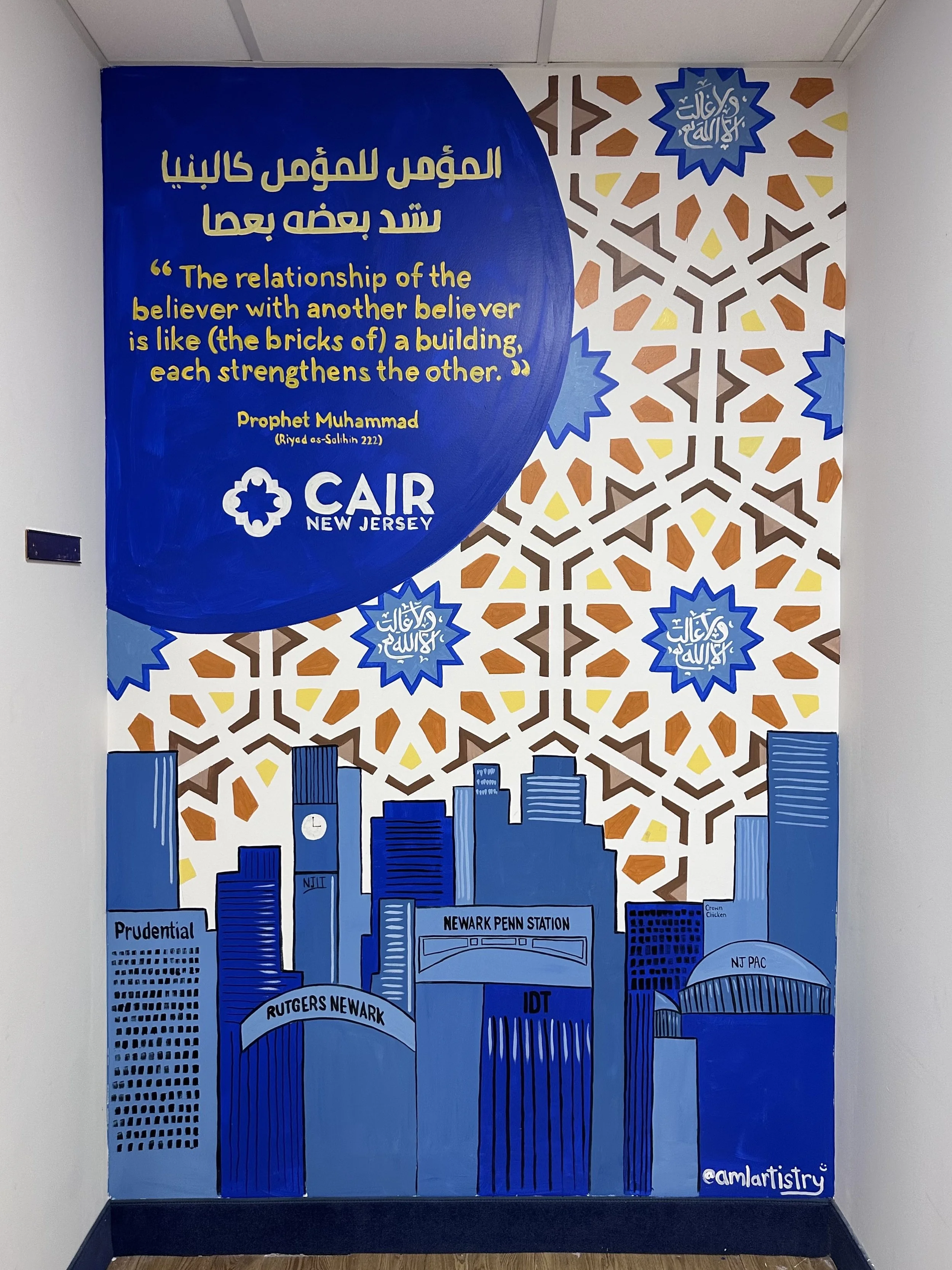 Colorful mural featuring a blue circle with a quote about relationships, cartoon-style cityscape with buildings labeled Rutgers Newark and Newark Penn Station, and Islamic geometric patterns with Arabic calligraphy in blue.