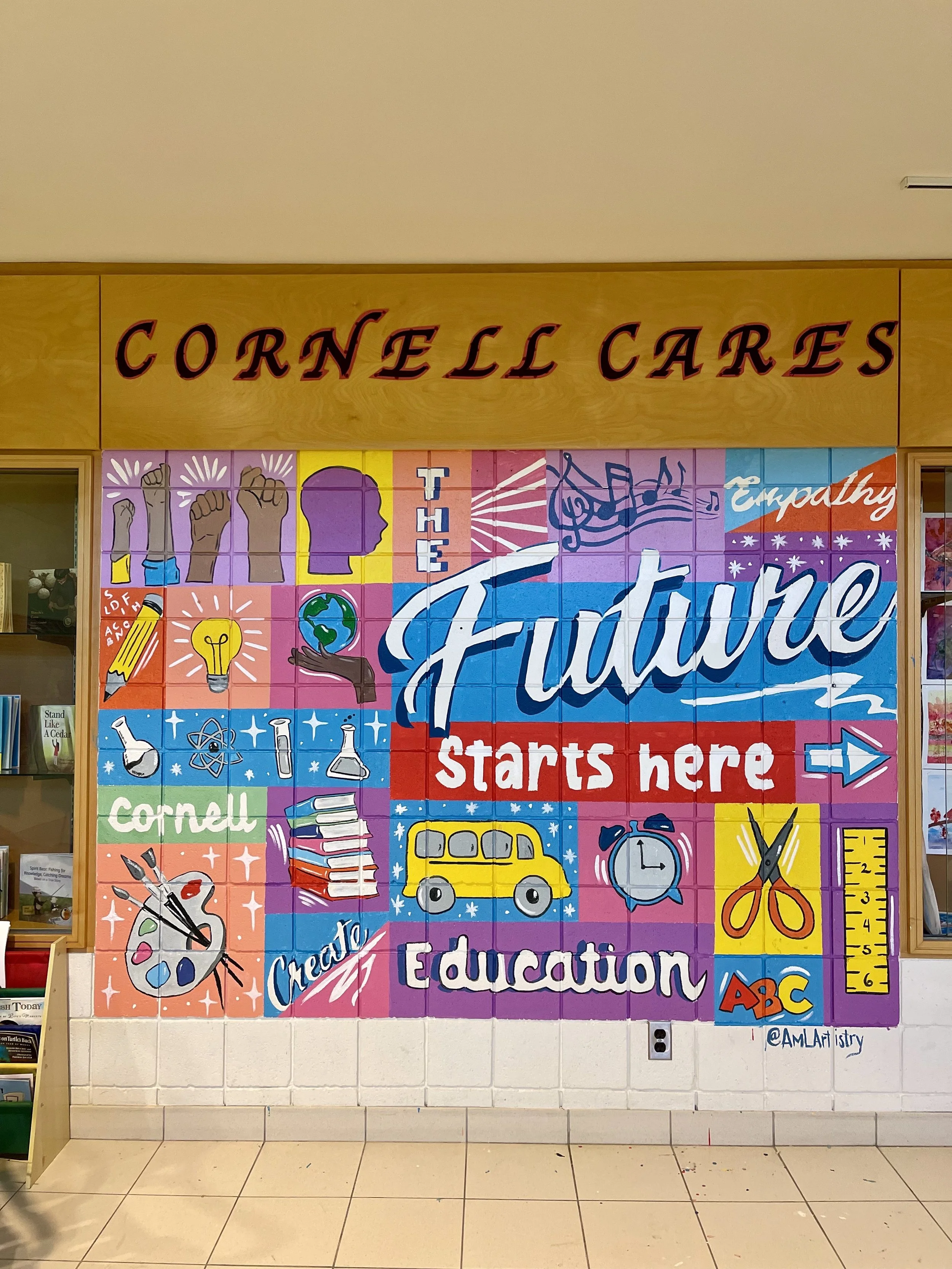 Colorful mural with school-themed doodles and motivational text, including a yellow school bus, books, scissors, paint palette, light bulb, and musical notes, promoting education and creativity at Cornell.