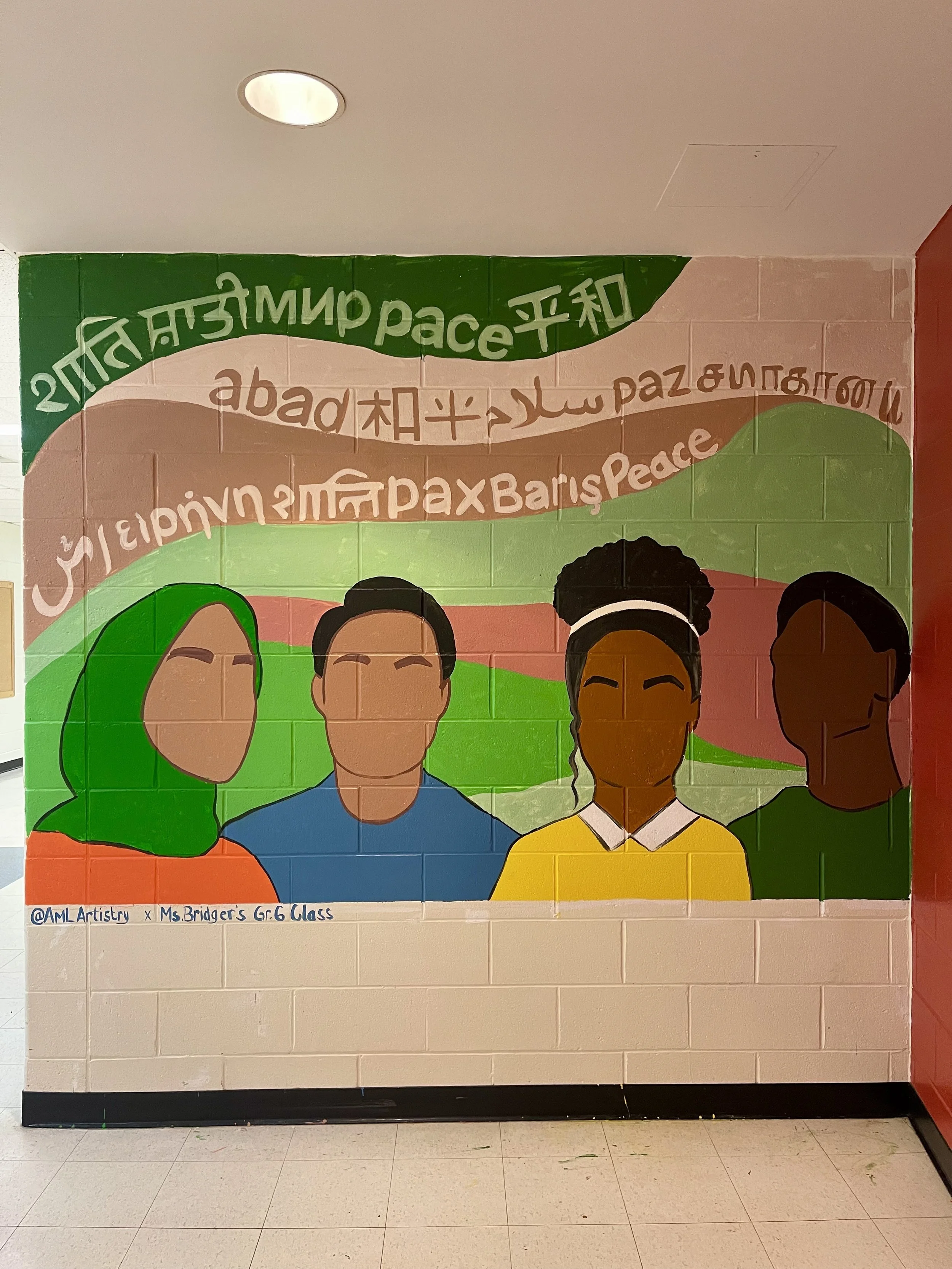 Colorful mural illustrating four diverse people against a background of rolling hills, with words in multiple languages for peace, love, and harmony at the top.